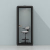 Quell Acoustic Plus Soundproof pod in black, light blue background, light office workspace
